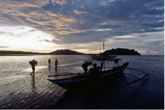 Villagers returning home as the sun sets in the Philippines (Source: UN Photo/Od